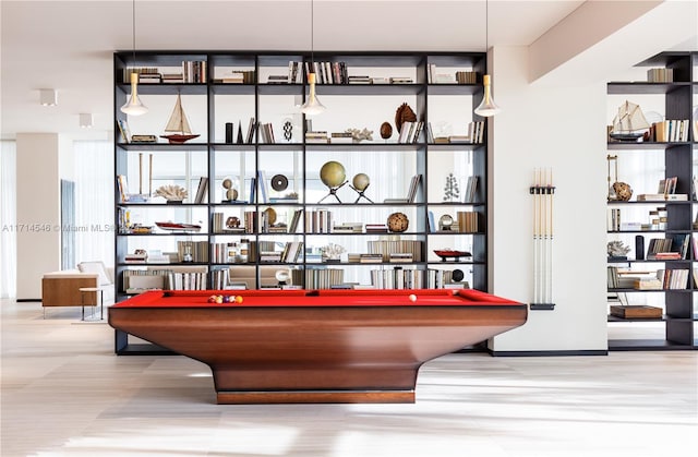 bar with decorative light fixtures and pool table