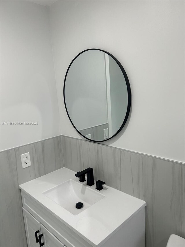 bathroom with shower / bath combination with glass door and toilet