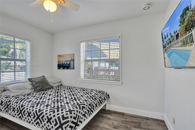 bedroom featuring ceiling fan and dark wood-type flooring