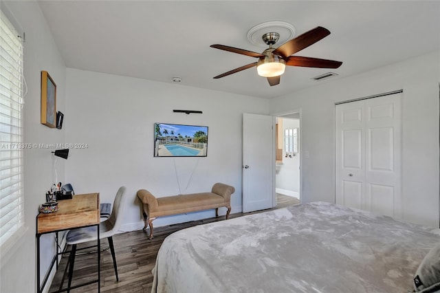 bedroom featuring a closet, ceiling fan, and dark hardwood / wood-style floors