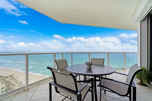 balcony with a view of the beach and a water view