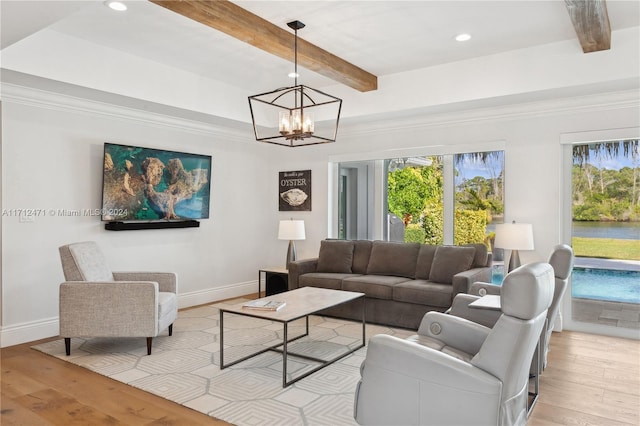 living room with light hardwood / wood-style flooring, beamed ceiling, and an inviting chandelier