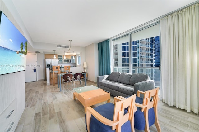 living room with light hardwood / wood-style floors