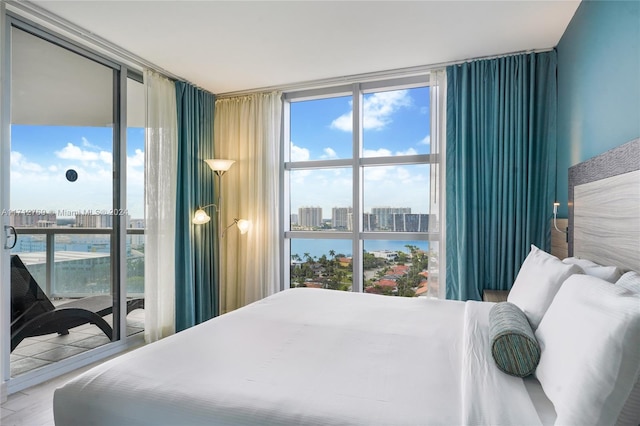 bedroom featuring expansive windows and multiple windows