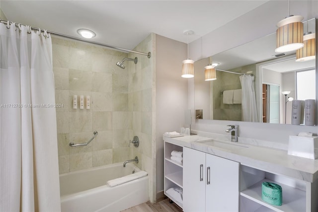 bathroom featuring vanity, wood-type flooring, and shower / tub combo