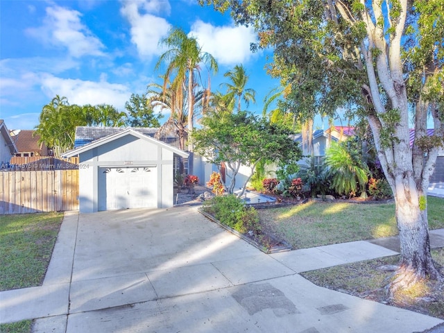 view of front of house featuring a garage and a front yard