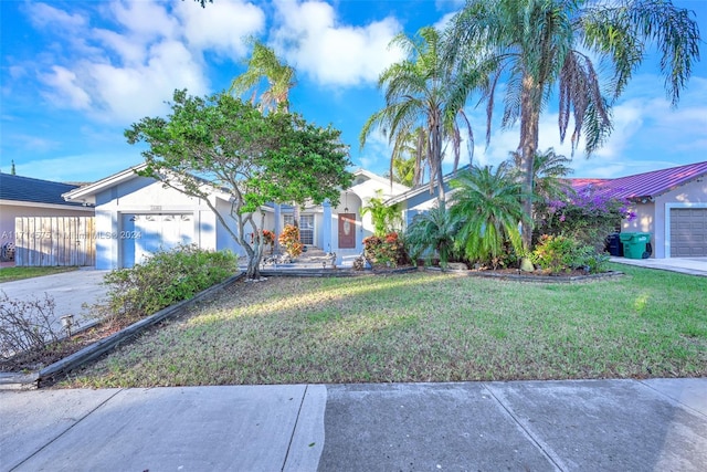 obstructed view of property featuring a front yard and a garage