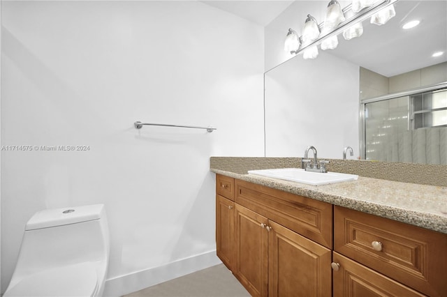 bathroom with vanity, toilet, and walk in shower