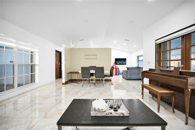 living room featuring vaulted ceiling