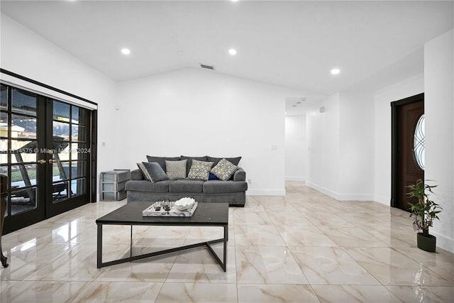 living room with french doors and lofted ceiling