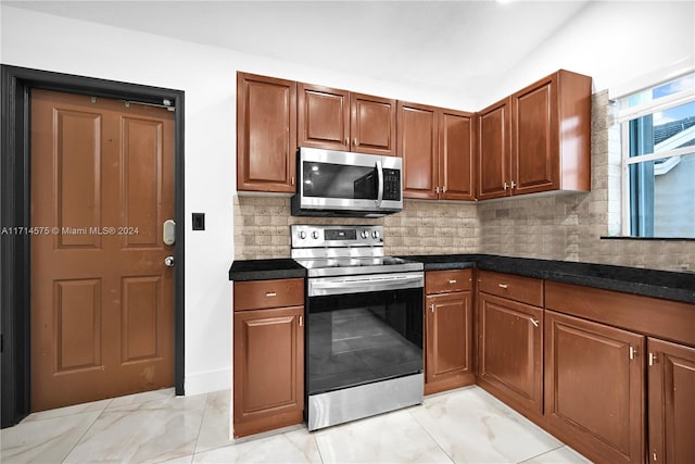 kitchen featuring decorative backsplash and stainless steel appliances