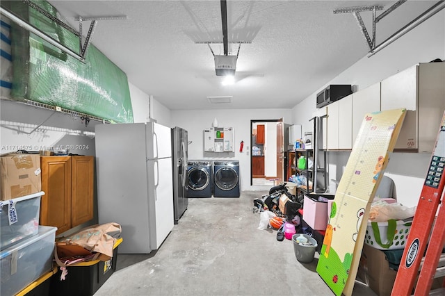 interior space featuring washer and dryer, white refrigerator, and a textured ceiling