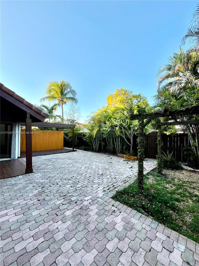 view of patio / terrace featuring fence