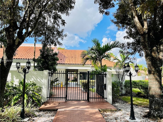 view of gate with fence