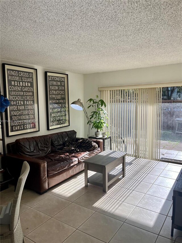 tiled living room with a textured ceiling