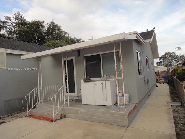 view of front of house with washer / clothes dryer