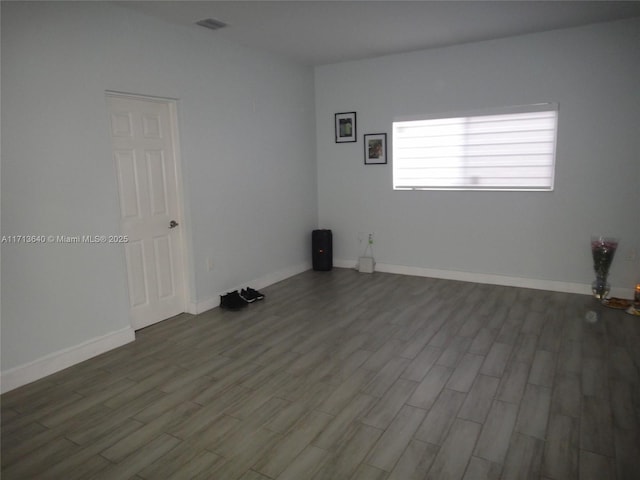 empty room featuring hardwood / wood-style flooring