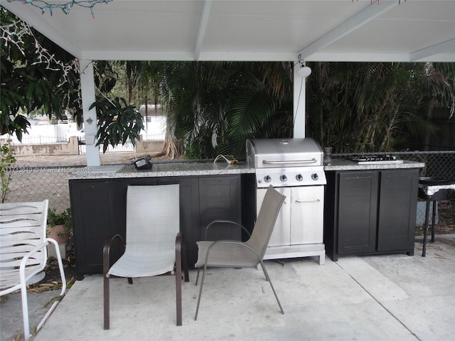 view of patio / terrace featuring area for grilling, exterior bar, and grilling area