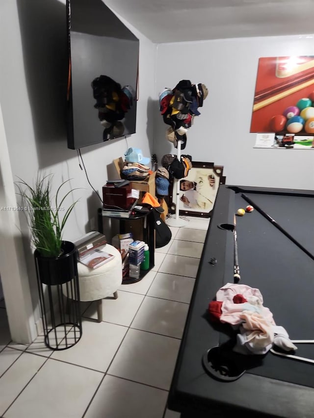 interior space with light tile patterned floors and pool table