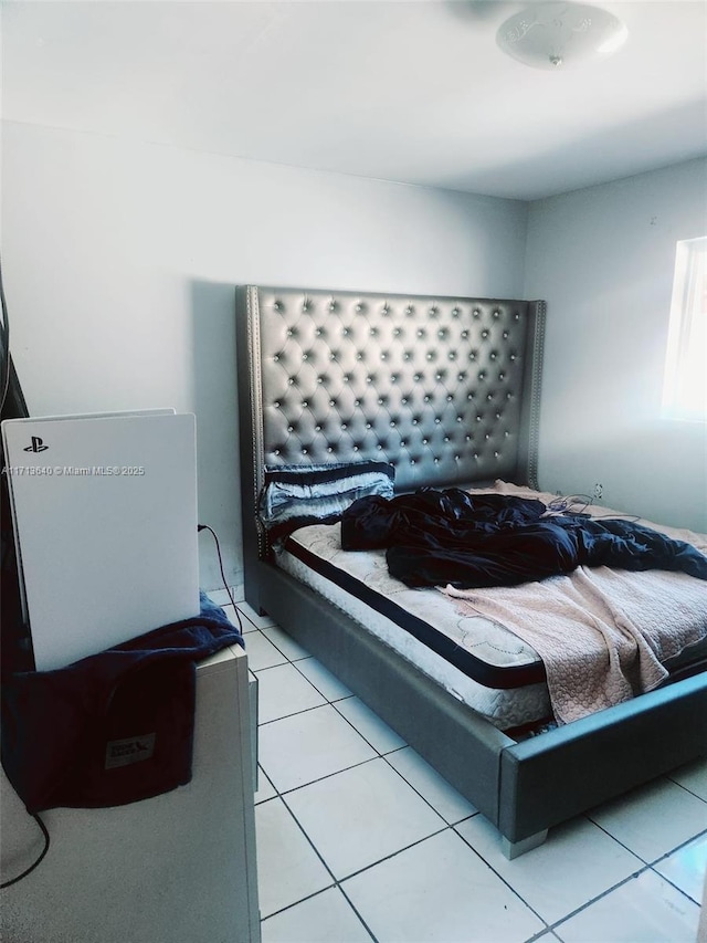 bedroom featuring light tile patterned flooring