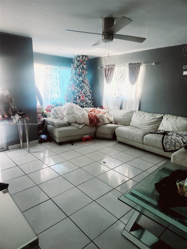 living room with ceiling fan and light tile patterned floors