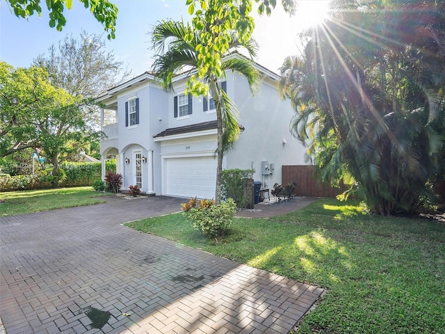 view of front facade featuring a garage and a front lawn