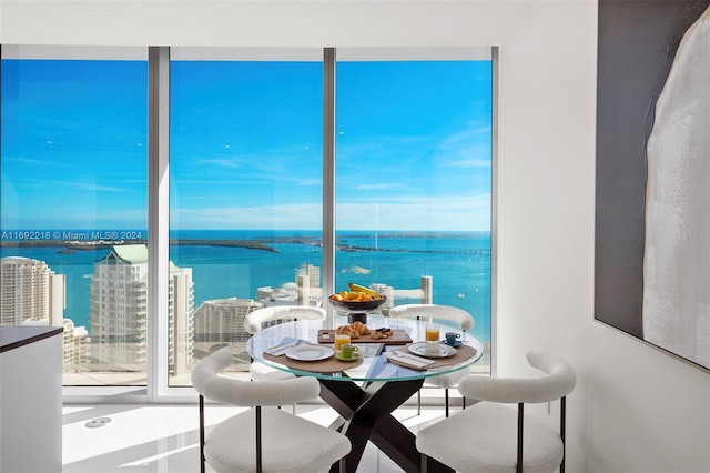 dining space featuring a water view