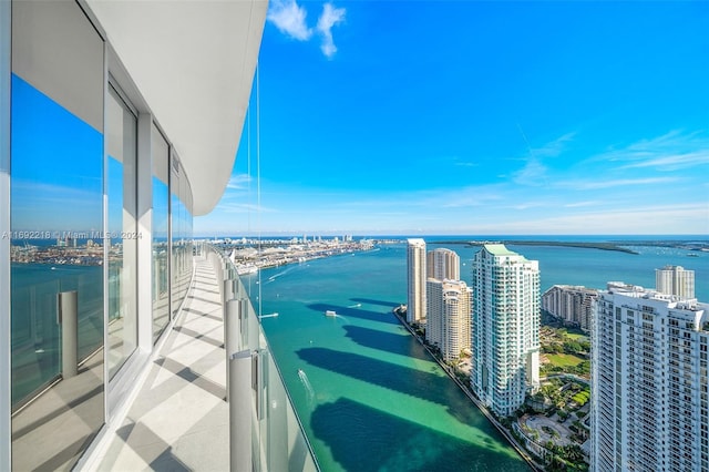 balcony featuring a water view