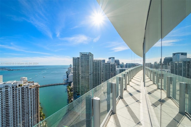 balcony featuring a water view