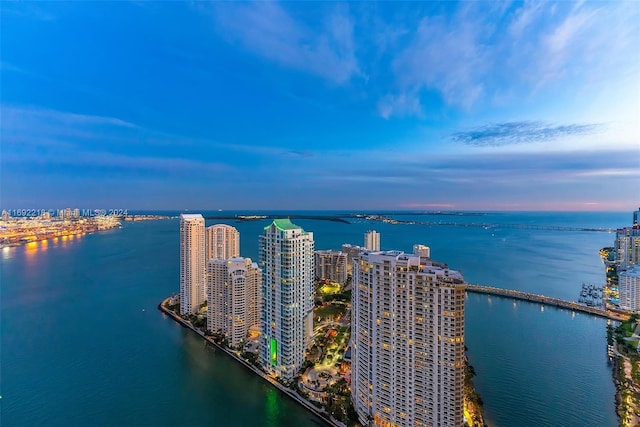 aerial view at dusk with a water view