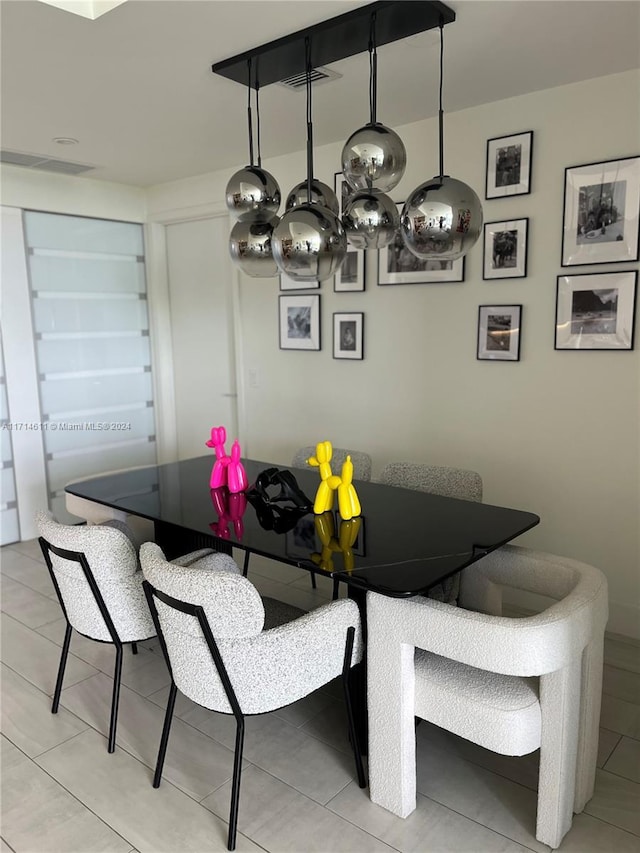 dining room featuring light tile patterned floors