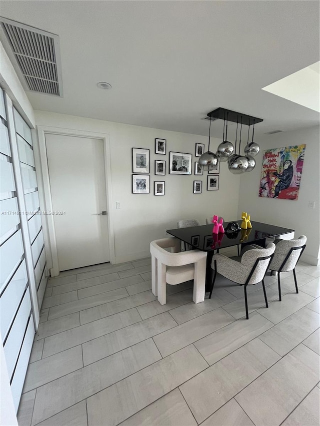 dining space with light tile patterned flooring