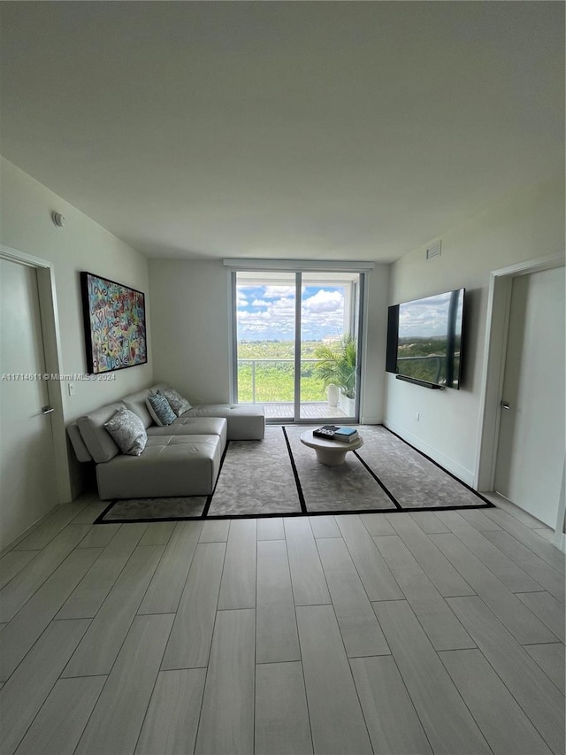 unfurnished living room with floor to ceiling windows