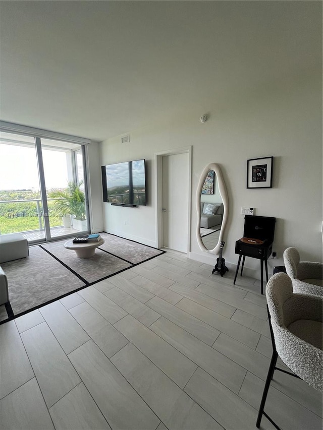 unfurnished living room with floor to ceiling windows