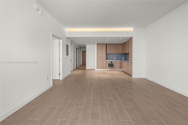 unfurnished living room with light hardwood / wood-style floors