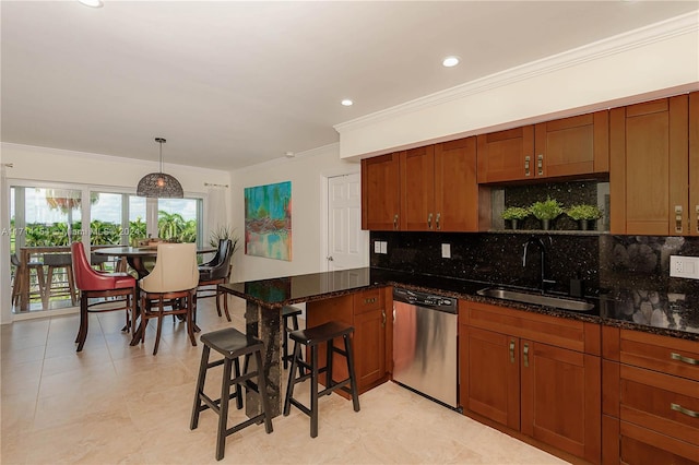 kitchen featuring ornamental molding, sink, decorative light fixtures, dark stone countertops, and dishwasher