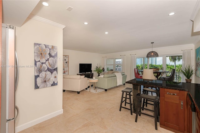 dining space featuring ornamental molding