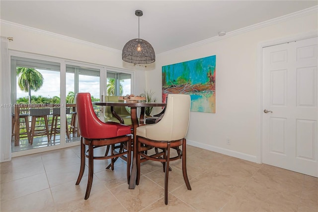 dining area featuring crown molding