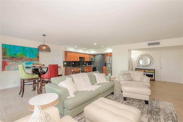 living room featuring light tile patterned floors and ornamental molding