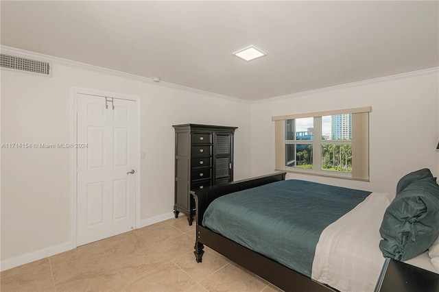 tiled bedroom featuring crown molding