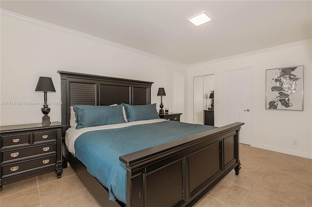 bedroom with crown molding, a closet, and light tile patterned floors