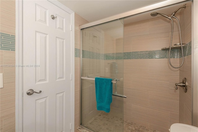 bathroom featuring an enclosed shower