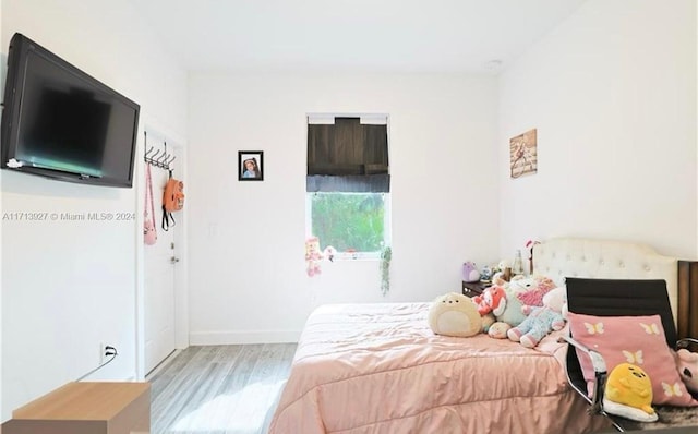 bedroom with light wood-type flooring