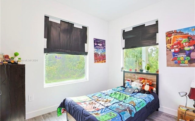 bedroom featuring light wood-type flooring