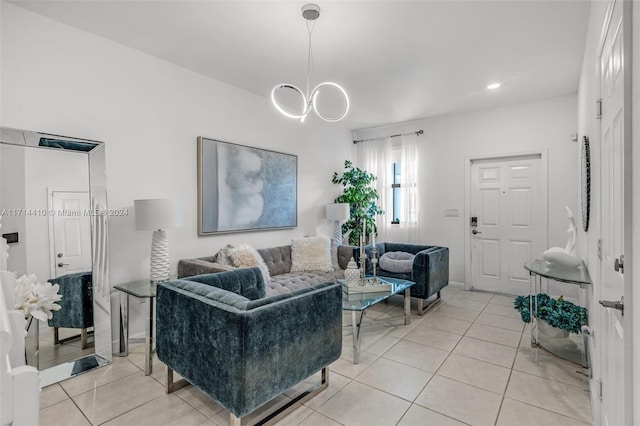 tiled living room featuring a chandelier