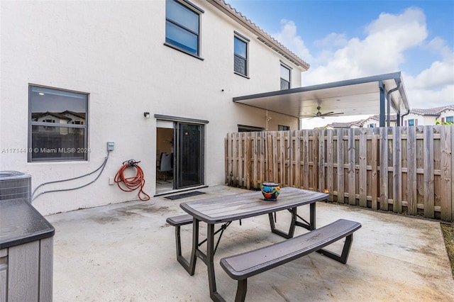 view of patio / terrace with ceiling fan and central AC