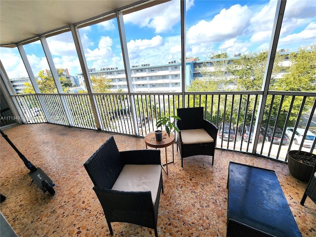 sunroom / solarium featuring a healthy amount of sunlight