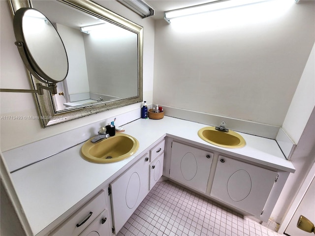 bathroom with tile patterned flooring and vanity