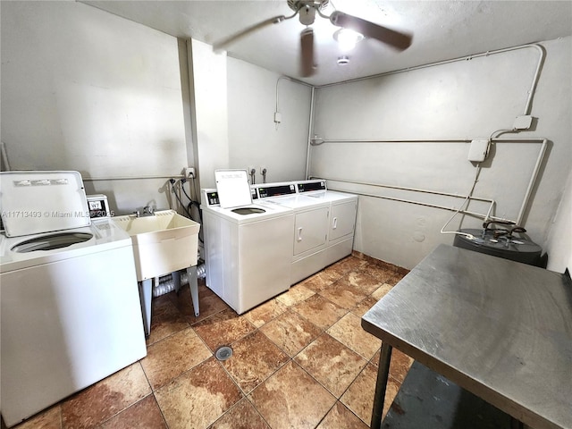 community laundry room with a ceiling fan and washing machine and dryer