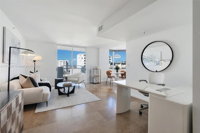 office area featuring floor to ceiling windows